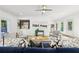 Cozy living room with stylish furniture, hardwood floors, and a modern ceiling fan at 1998 Shalimar Ne Dr, Atlanta, GA 30345