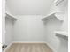 Bright walk-in closet with built-in shelves and rods at 1998 Shalimar Ne Dr, Atlanta, GA 30345