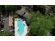 Aerial view of the community pool with lounge chairs and adjacent parking at 211 Summit North Drive Ne, Atlanta, GA 30324