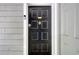 The front door features a classic design, enhancing the home's curb appeal at 211 Summit North Drive Ne, Atlanta, GA 30324
