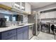 Contemporary kitchen featuring stainless steel appliances, mosaic backsplash, and ample storage at 211 Summit North Drive Ne, Atlanta, GA 30324