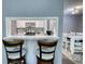 Stylish kitchen pass-through with bar seating and modern appliances, perfect for entertaining at 211 Summit North Drive Ne, Atlanta, GA 30324
