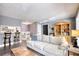 Cozy living room featuring hardwood floors, a comfortable sofa, and built-in shelving for storage at 211 Summit North Drive Ne, Atlanta, GA 30324