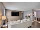 Cozy living room featuring modern decor, a large TV, and stylish furnishings at 211 Summit North Drive Ne, Atlanta, GA 30324