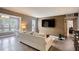 Inviting living room with wood paneling, large screen TV, and comfortable seating at 211 Summit North Drive Ne, Atlanta, GA 30324