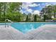 Community pool with a concrete deck and stainless steel rails at 211 Summit North Drive Ne, Atlanta, GA 30324