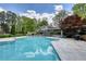 Community pool with lounge seating, lush landscaping, and nearby clubhouse at 211 Summit North Drive Ne, Atlanta, GA 30324