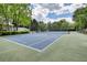 Outdoor tennis court surrounded by lush greenery at 211 Summit North Drive Ne, Atlanta, GA 30324