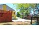 Expansive backyard featuring a spacious deck with stairs and a glimpse of the surrounding neighborhood at 2319 Lochinver Ln, Conyers, GA 30094