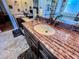 Close-up on bathroom double sink vanity with a decorative stone countertop at 2319 Lochinver Ln, Conyers, GA 30094
