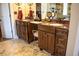 Dual sink bathroom with granite countertops, wooden cabinets, and stylish fixtures for a luxurious feel at 2319 Lochinver Ln, Conyers, GA 30094