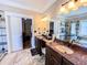 Bathroom with double sinks, glass enclosed shower and view into main bedroom at 2319 Lochinver Ln, Conyers, GA 30094