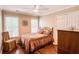 Cozy bedroom with hardwood floors, natural light, and a comfortable bed, creating a welcoming atmosphere at 2319 Lochinver Ln, Conyers, GA 30094