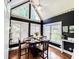 This charming breakfast nook features many windows, vaulted ceiling, and is perfect for casual dining at 2319 Lochinver Ln, Conyers, GA 30094