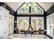 Charming dining area with a vaulted ceiling, lots of windows, and a round table set for dinner at 2319 Lochinver Ln, Conyers, GA 30094