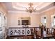 Bright dining room featuring hardwood floors, trey ceilings, and stylish decor at 2319 Lochinver Ln, Conyers, GA 30094