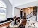 Foyer features a staircase with decorative iron railings and elegant lighting at 2319 Lochinver Ln, Conyers, GA 30094