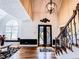 Stunning foyer with a chandelier, textured walls, and elegant staircase at 2319 Lochinver Ln, Conyers, GA 30094