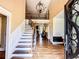 Grand foyer with a soaring ceiling, staircase, and hardwood floors at 2319 Lochinver Ln, Conyers, GA 30094
