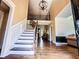 Inviting foyer with high ceilings, staircase, and gleaming hardwood floors at 2319 Lochinver Ln, Conyers, GA 30094