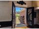 View from inside showcasing the home's ornate black double front doors at 2319 Lochinver Ln, Conyers, GA 30094