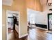 Hallway view into a kitchen with white cabinetry and a dining area, leading to the home's ornate entry at 2319 Lochinver Ln, Conyers, GA 30094