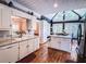 Well-lit kitchen featuring white cabinets, granite countertops, an island, and stainless steel appliances at 2319 Lochinver Ln, Conyers, GA 30094