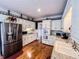 Spacious kitchen with granite countertops, stainless steel appliances, and white cabinetry at 2319 Lochinver Ln, Conyers, GA 30094