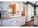 Bright kitchen with white cabinetry, granite counters, and stainless steel appliances at 2319 Lochinver Ln, Conyers, GA 30094