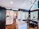 Bright kitchen boasts eat-in kitchen, stainless appliances, white cabinetry, granite counters, and modern fixtures at 2319 Lochinver Ln, Conyers, GA 30094