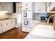 Kitchen boasts white cabinets, stainless steel appliances, and granite countertops at 2319 Lochinver Ln, Conyers, GA 30094