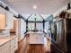 Bright and airy kitchen featuring an eat-in breakfast nook, stainless steel appliances, and modern fixtures at 2319 Lochinver Ln, Conyers, GA 30094