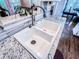 Bright double kitchen sink with granite countertop and modern faucet in a lovely updated space at 2319 Lochinver Ln, Conyers, GA 30094