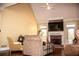 Bright living room featuring a brick fireplace, high ceilings, and comfortable seating arrangements at 2319 Lochinver Ln, Conyers, GA 30094