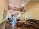 Spacious living room with high ceilings, a balcony, hardwood floors, and ample seating at 2319 Lochinver Ln, Conyers, GA 30094