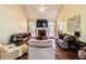 Inviting living room with a fireplace, vaulted ceilings, and hardwood flooring at 2319 Lochinver Ln, Conyers, GA 30094