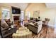 Comfortable living room with vaulted ceilings, fireplace, and hardwood floors at 2319 Lochinver Ln, Conyers, GA 30094