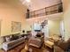 Bright and open living room with a balcony and hardwood floors offering comfortable seating and natural light at 2319 Lochinver Ln, Conyers, GA 30094