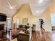 Bright living room with vaulted ceilings, a fireplace, and hardwood floors at 2319 Lochinver Ln, Conyers, GA 30094