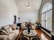 Bright living room features high ceilings, large windows, and hardwood flooring at 2319 Lochinver Ln, Conyers, GA 30094