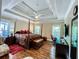Spacious main bedroom featuring hardwood floors, trey ceilings, and ample natural light at 2319 Lochinver Ln, Conyers, GA 30094