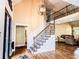 Staircase with decorative iron railings and wooden steps at 2319 Lochinver Ln, Conyers, GA 30094