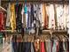 Organized walk-in closet featuring rods and shelves, maximizing storage space for clothing and accessories at 2319 Lochinver Ln, Conyers, GA 30094
