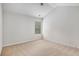Spacious carpeted bedroom with a ceiling fan and a window offers a peaceful retreat at 859 Walking Stick Trl, Auburn, GA 30011