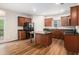 Well-equipped kitchen with dark wood cabinets, granite countertops, and a center island at 859 Walking Stick Trl, Auburn, GA 30011