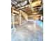 Unfinished basement with wood framing, concrete floors, and exposed insulated ceiling at 2671 Moon Chase Ln, Buford, GA 30519