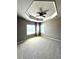 Spacious bedroom featuring neutral carpeting, ceiling fan and two bright windows at 2671 Moon Chase Ln, Buford, GA 30519