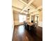 Chic dining room highlighting the hardwood floors, coffered ceilings, and large windows at 2671 Moon Chase Ln, Buford, GA 30519