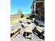 Stone fire pit in the backyard with Adirondack chairs surrounding it at 2671 Moon Chase Ln, Buford, GA 30519