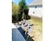 Backyard fire pit area with Adirondack chairs and pea gravel at 2671 Moon Chase Ln, Buford, GA 30519
